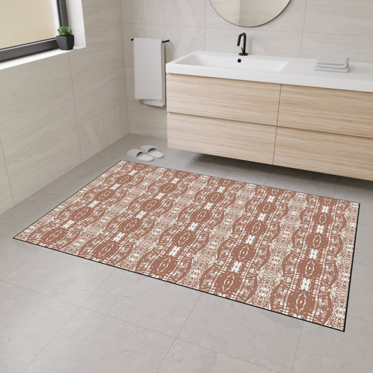 a heavy duty rug/mat on a bathroom floor featuring the design by elizabeth domogala named Half Bamboo© in mocha. The mat is set in a bathroom with a vanity and mirror in the background.